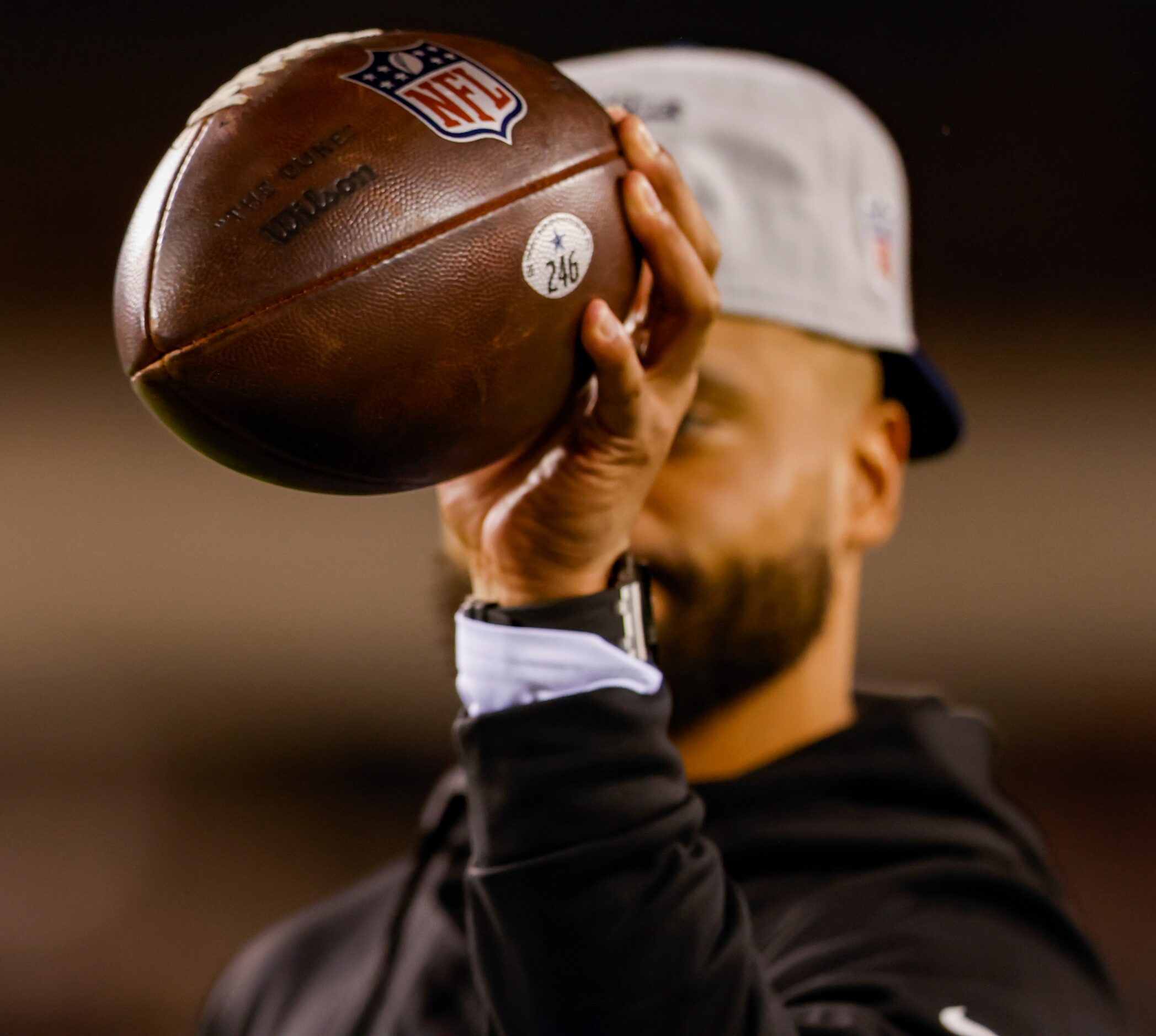 Dallas Cowboys quarterback Dak Prescott (4) holds a football after catching it with his left...