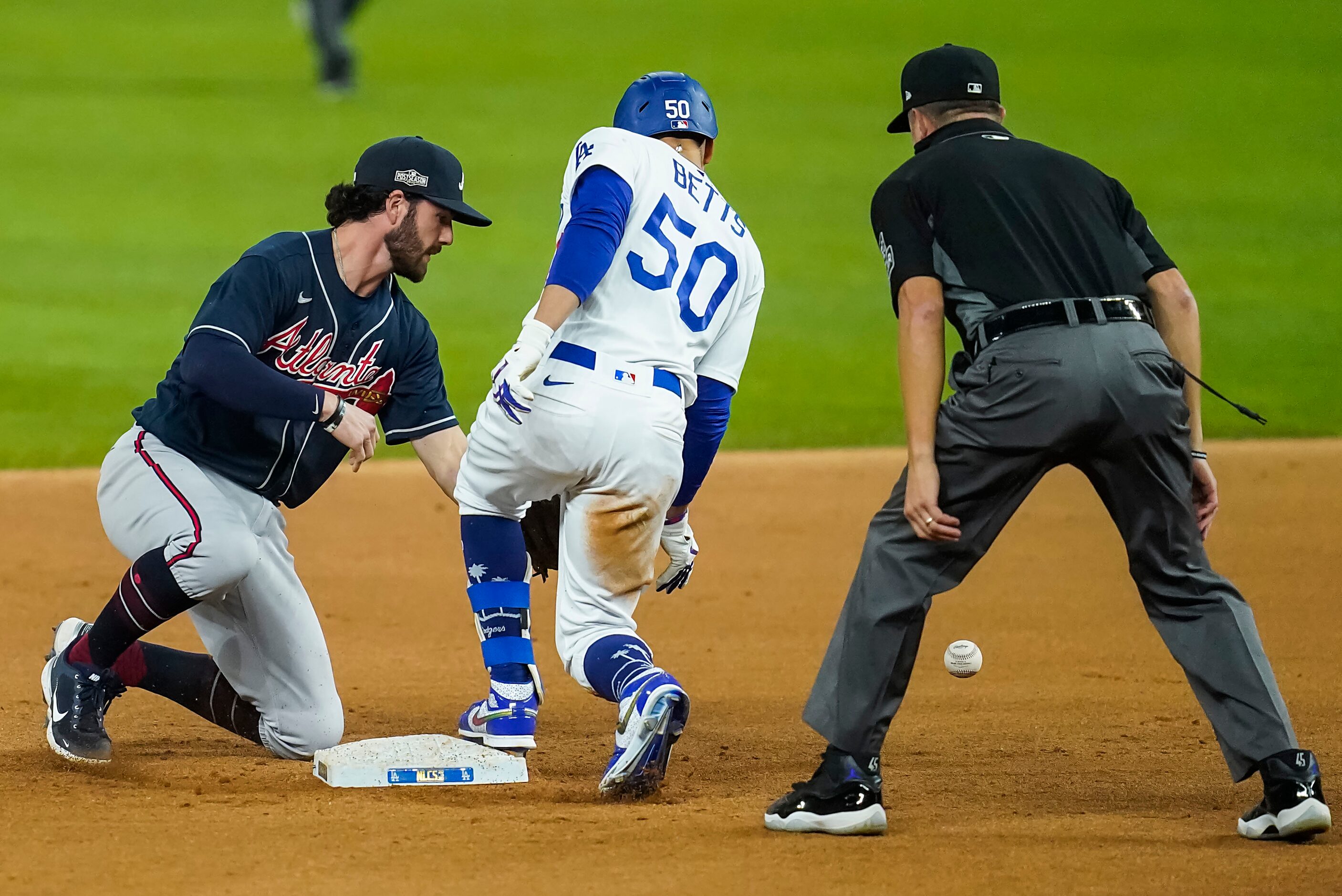 Los Angeles Dodgers right fielder Mookie Betts (50) is safe with a double at the ball gets...