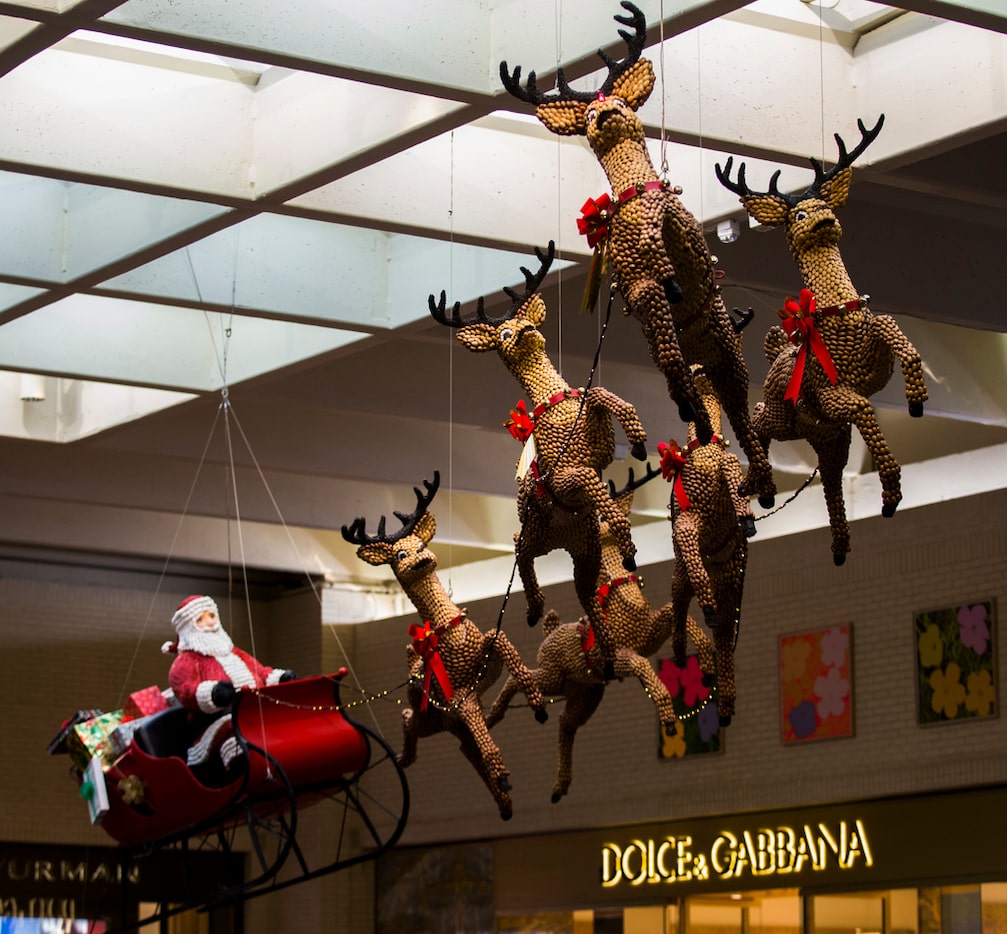 Santa and reindeer made of pecans, almonds and raisins is an original holiday decoration...