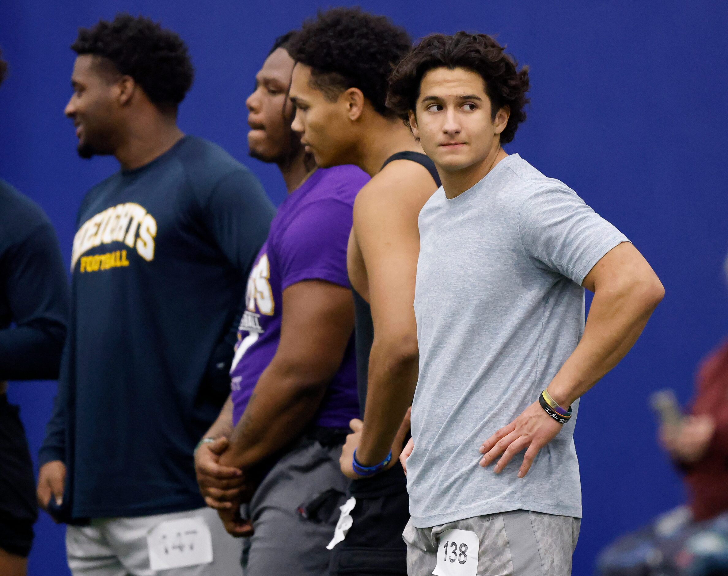 Unsigned senior running back Lance Crosby of Wylie High School (right) waits his turn to...