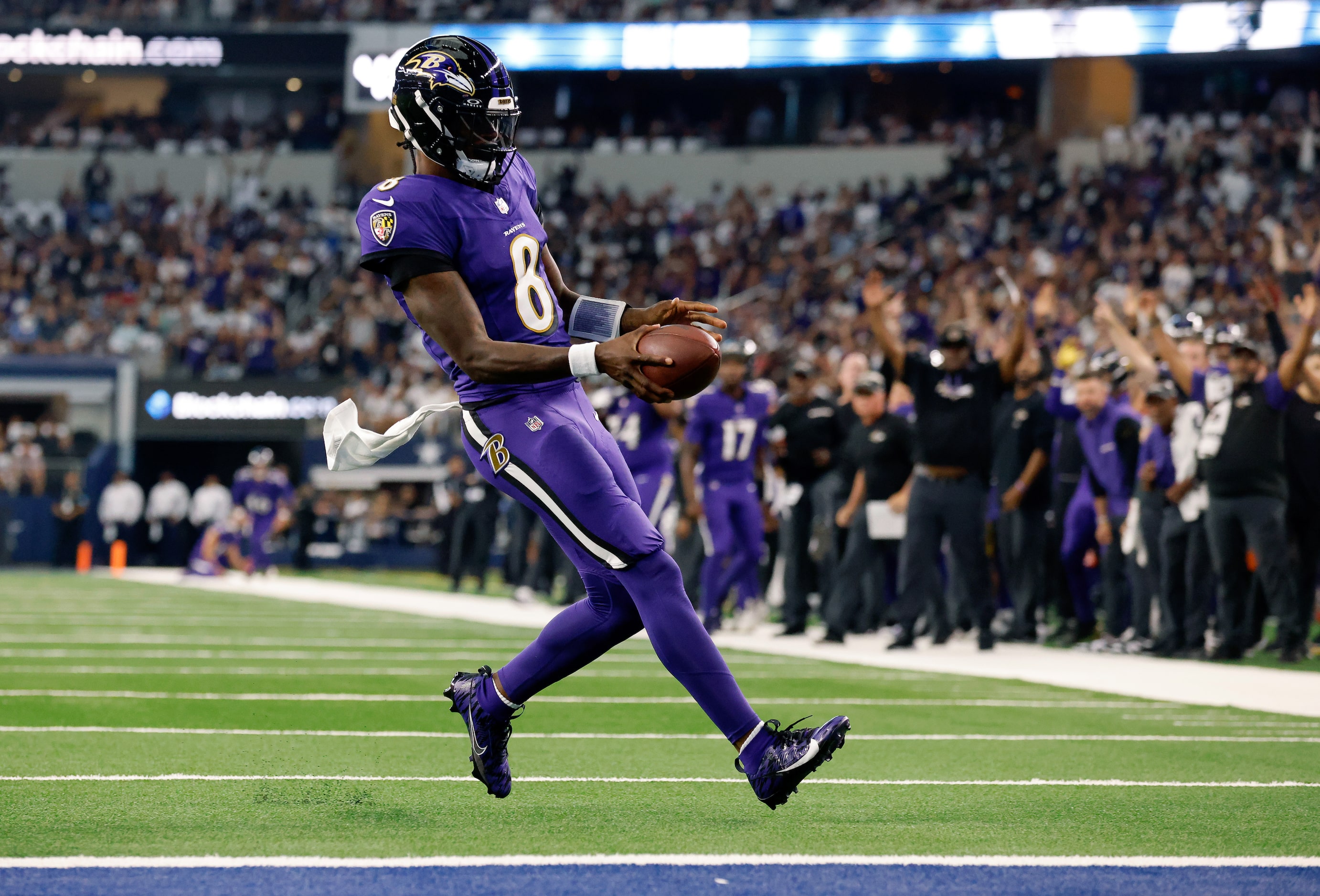 Baltimore Ravens quarterback Lamar Jackson (8) scores an easy first quarter touchdown...