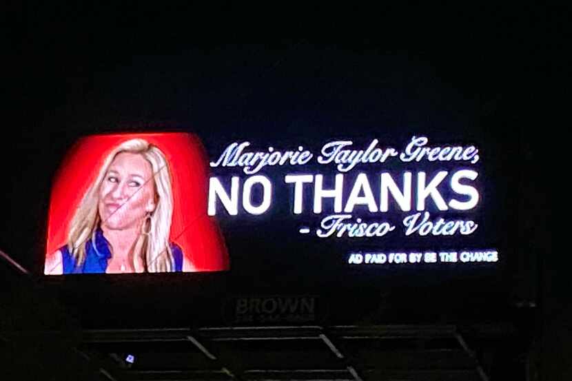 An anti-Marjorie Taylor Greene advertisement is displayed on a digital billboard in McKinney.