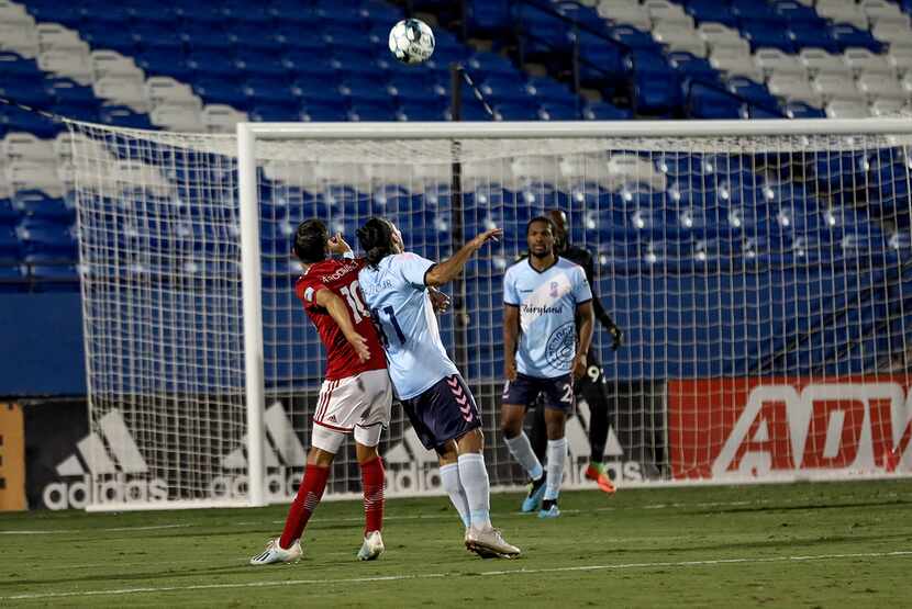 Arturo Rodriguez (#10) goes up for a header against Paulo Junior (#11) of Forward Madison in...