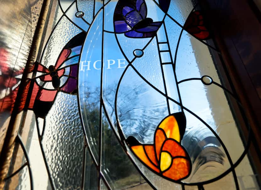 The view looking out through the stained glass windows of The Hope Chapel at The Gatehouse,...