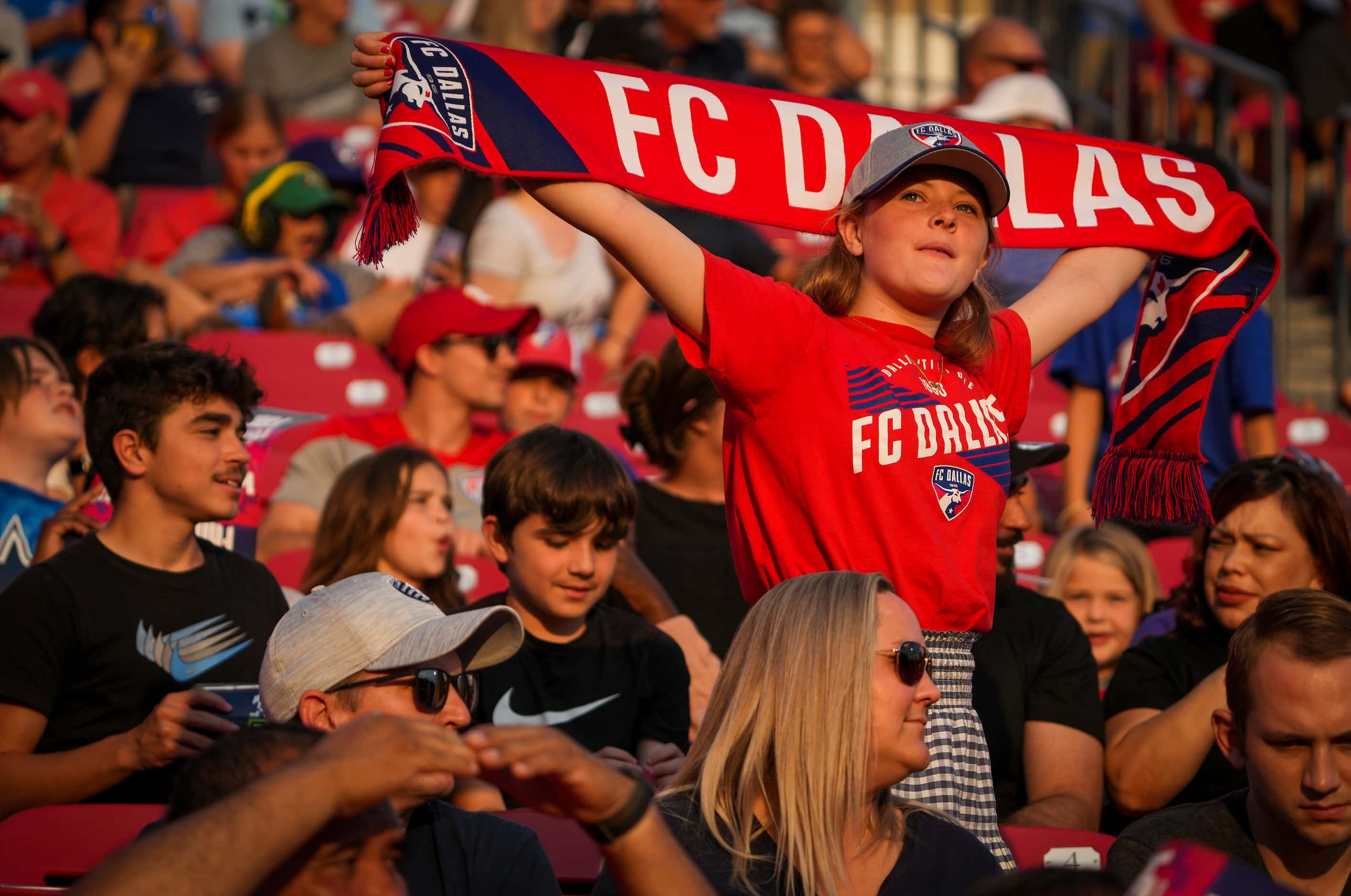 A fan show her support of FC Dallas during the second half of an MLS soccer match against...
