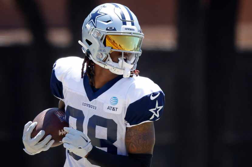 Dallas Cowboys wide receiver CeeDee Lamb (88) runs out a pass completion during training...