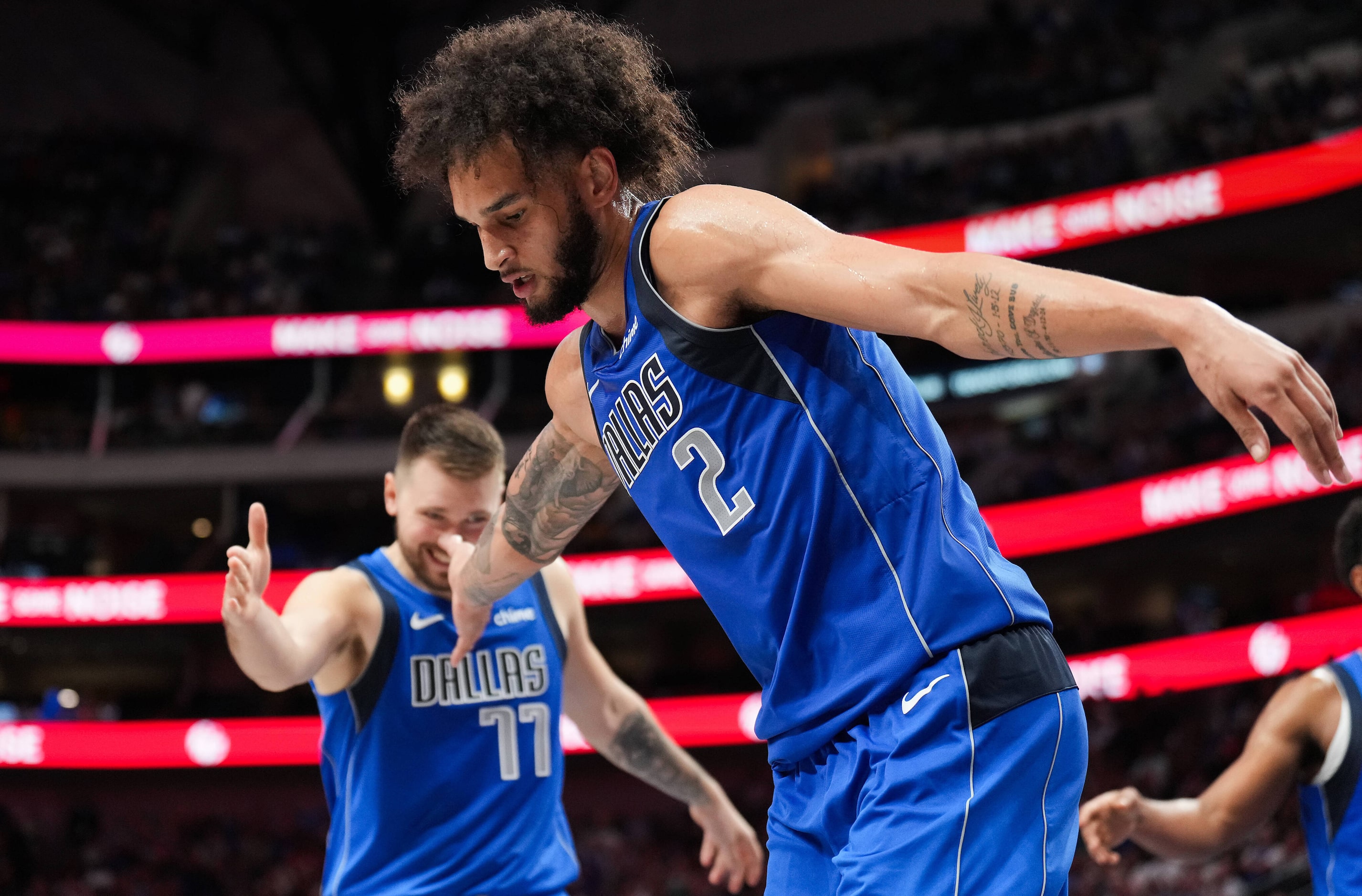 Dallas Mavericks center Dereck Lively II (2) celebrates with guard Luka Doncic (77) after...