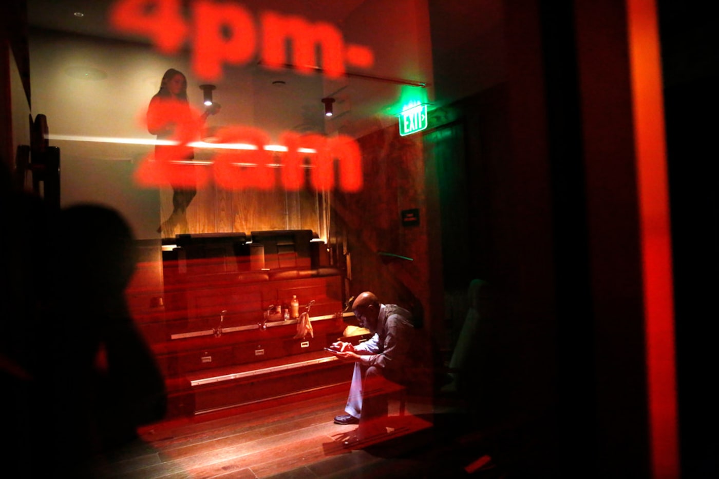 Mark Ayers sits at his shoe shine station at Bourbon & Banter speakeasy inside The Statler...