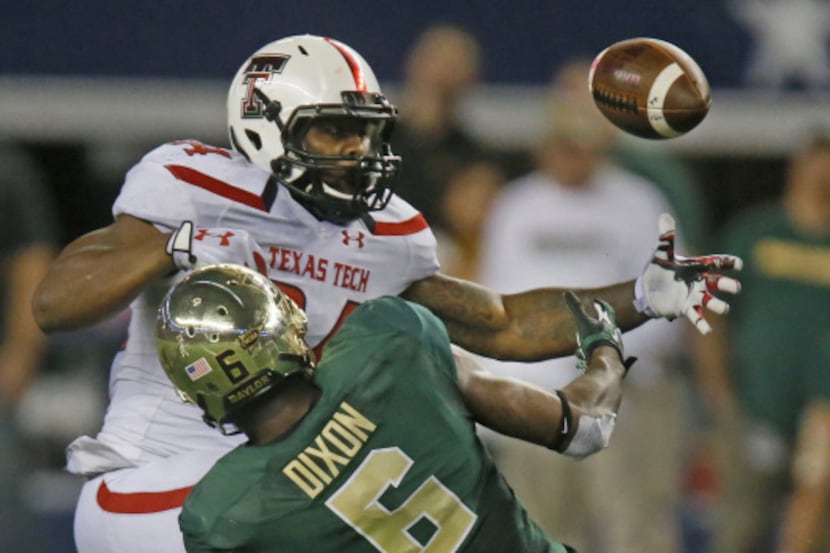 Baylor Bears safety Ahmad Dixon (6) forces as fumble from Texas Tech Red Raiders running...