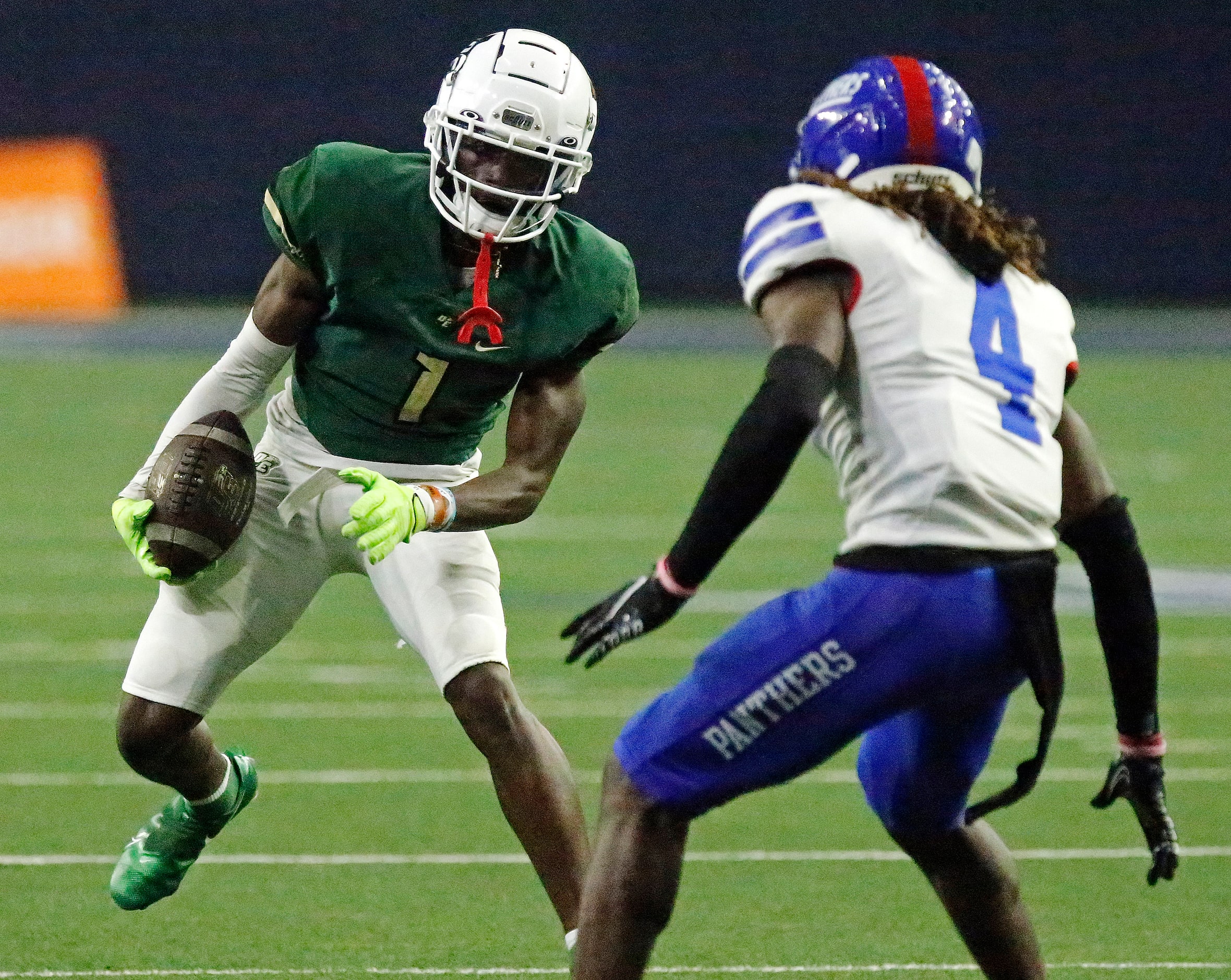 DeSoto High School wide receiver Johntay Cook II (1) looks to evade Duncanville High School...