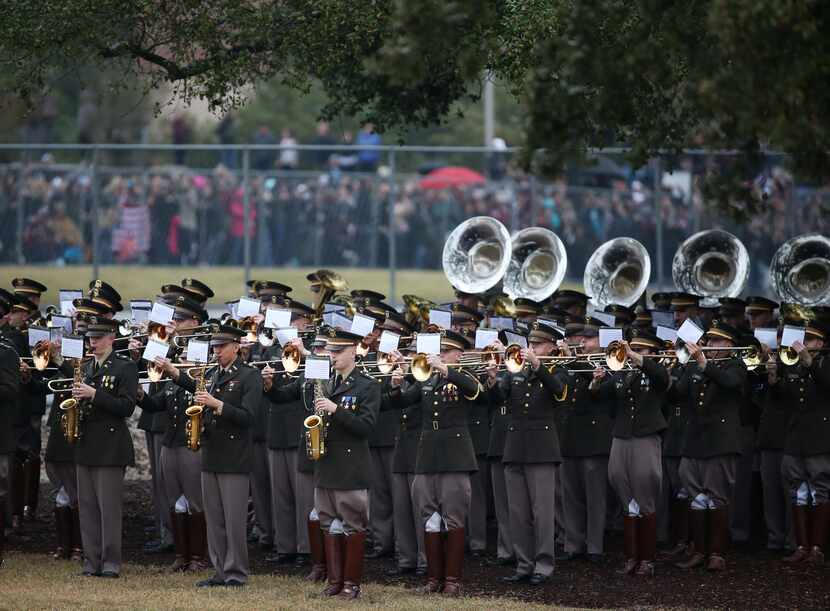 The Fighting Texas Aggie Band plays before the arrival of the funeral train carrying the...