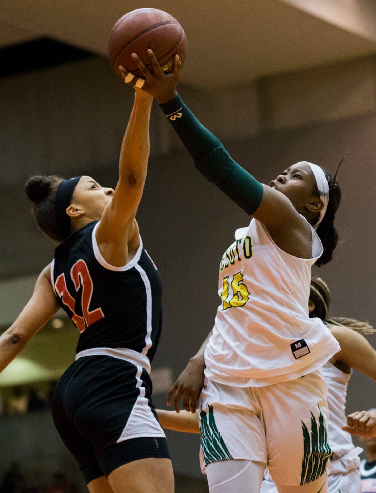 DeSoto's Michayla Gatewood (15) goes up for a shot that's blocked by Duncanville's Zaria...