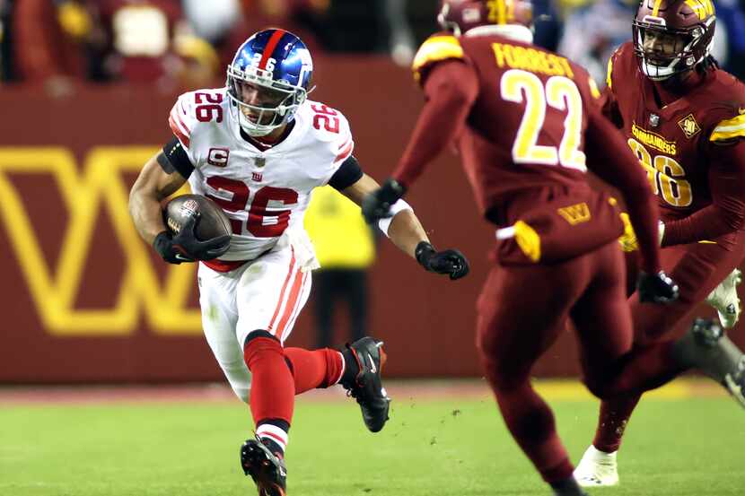 New York Giants running back Saquon Barkley (26) runs during an NFL football game against...