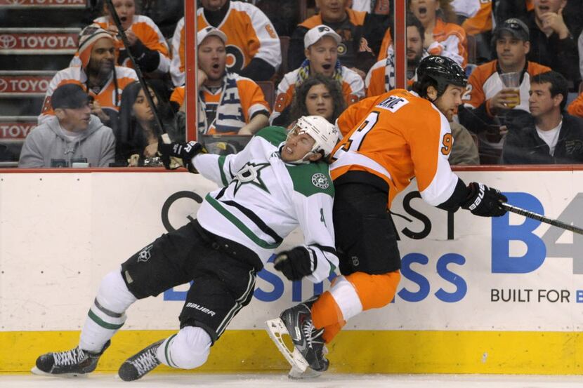 Mar 20, 2014; Philadelphia, PA, USA; Philadelphia Flyers right wing Steve Downie (9) checks...