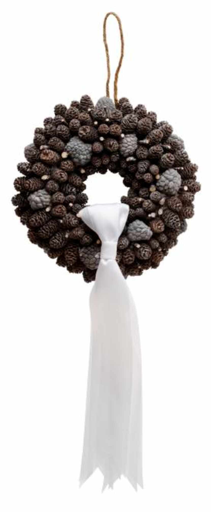 
A dainty wreath of conifer cones looks like it has been dusted with snow. $25, Cebolla Fine...