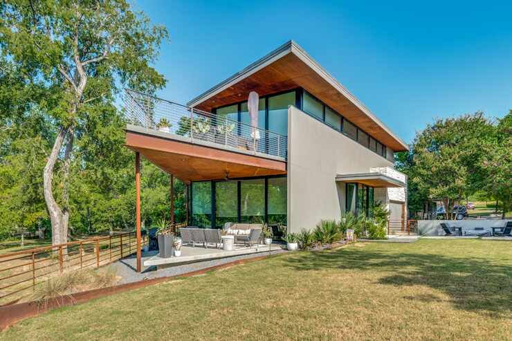 Exterior of modern home on a large yard.