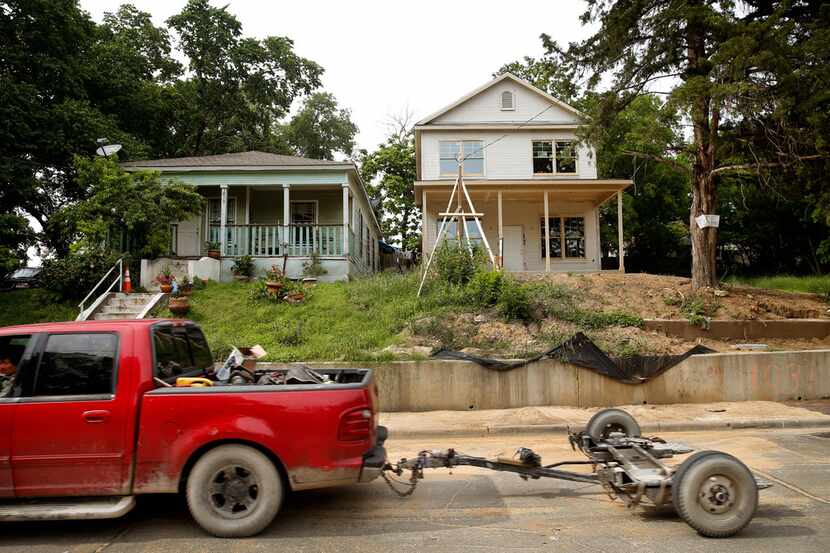 A new house is being built next to an old one on Church Street in the Tenth Street Historic...
