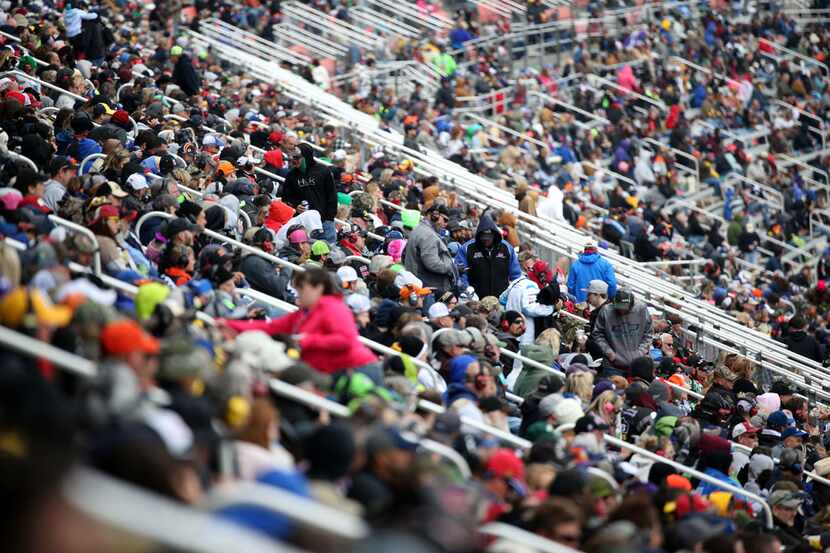 Fans watch the Monster Energy NASCAR O'Reilly Auto Parts 500 at Texas Motor Speedway in Fort...