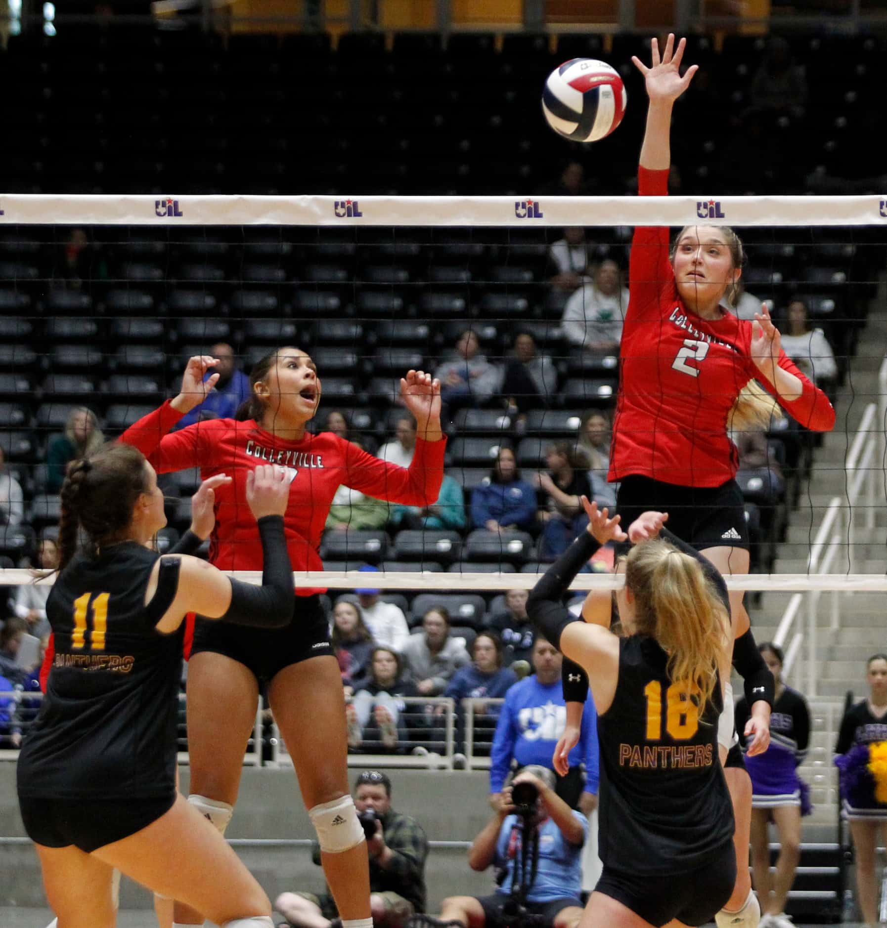 Colleyville Heritage sophomore Audrey Popp (2), right, spikes for a score as Amagine Gardner...