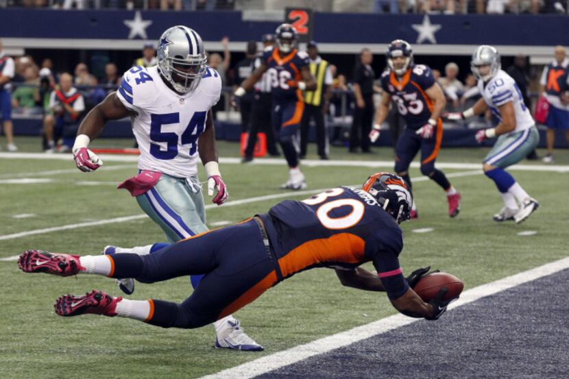 Denver Broncos tight end Julius Thomas (80) catches a touchdown in front of Dallas Cowboys...
