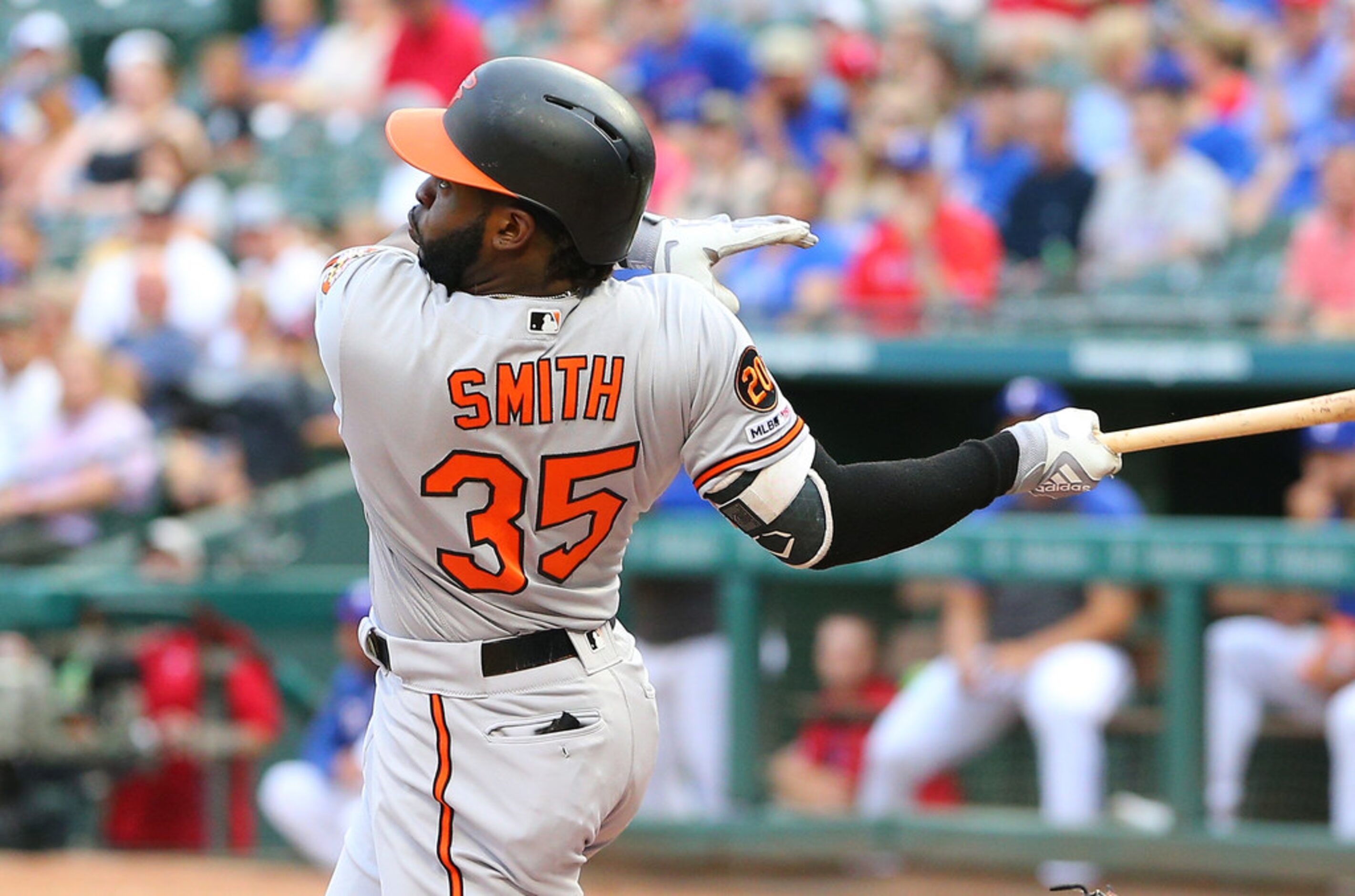 ARLINGTON, TX - JUNE 04:  Dwight Smith Jr. #35 of the Baltimore Orioles hits a three run...