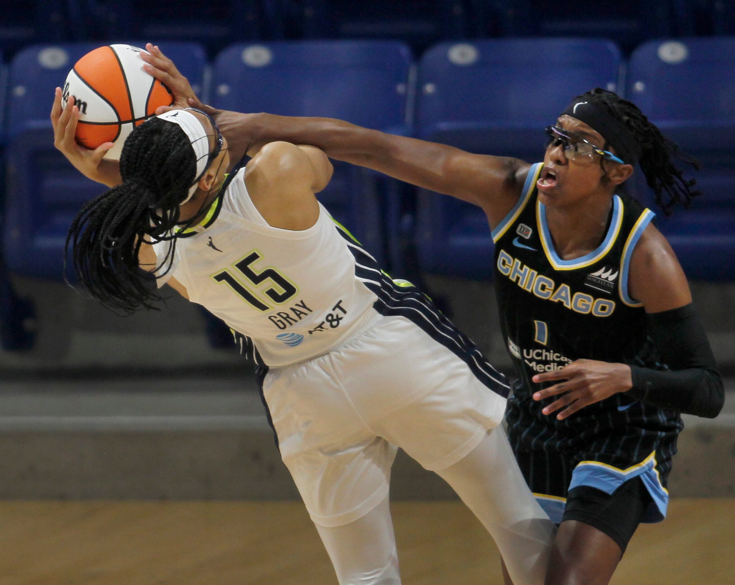 Dallas Wings guard Allisha Gray (15) is fouled by Chicago Sky guard Diamond DeShields (1) as...