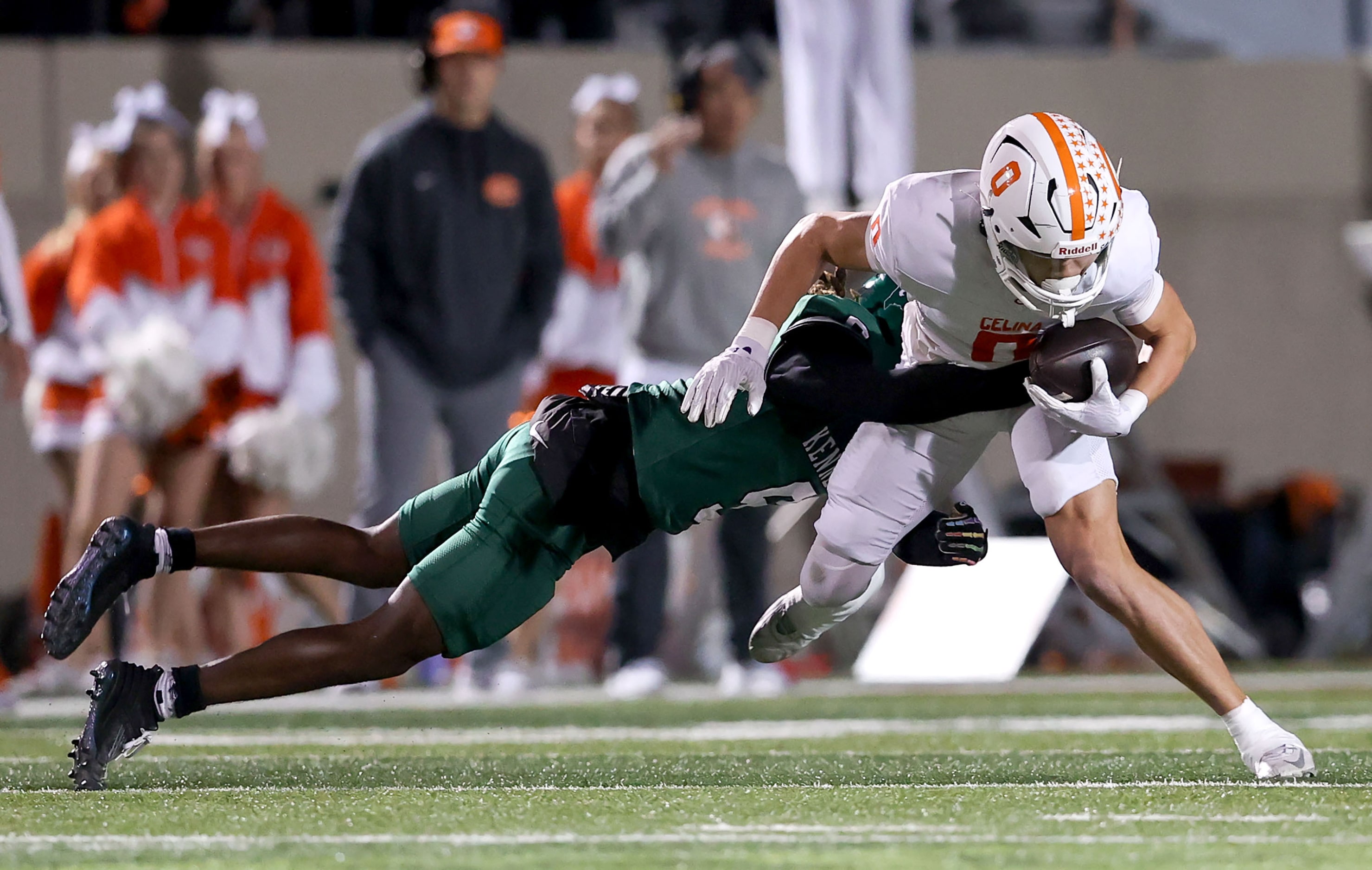 Celina wide receiver Ethan Rucker (0) comes up with a reception and is stopped by Kennedale...