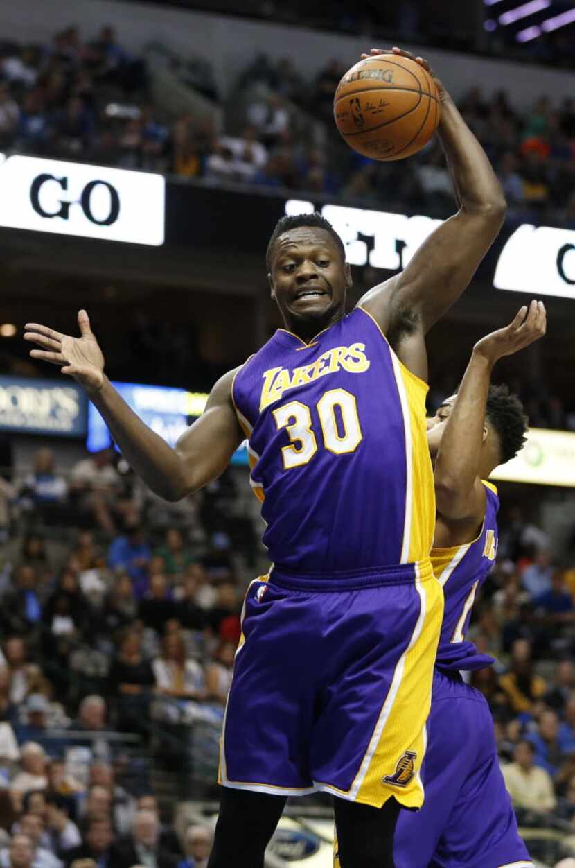 Los Angeles Lakers forward Julius Randle (30) rebounds in a game against the Dallas...