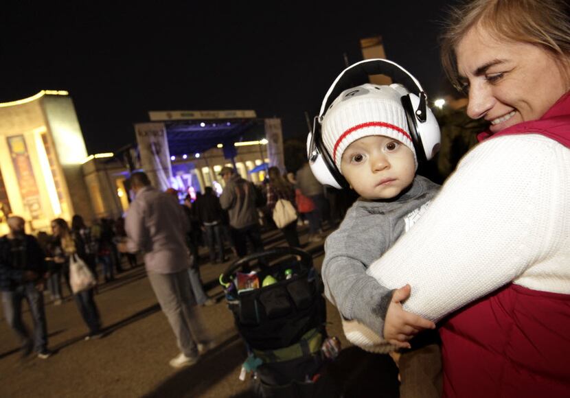 1-yr-old Duncan Clayton, left, and Laura Booker enjoy the music during the Untapped Festival...