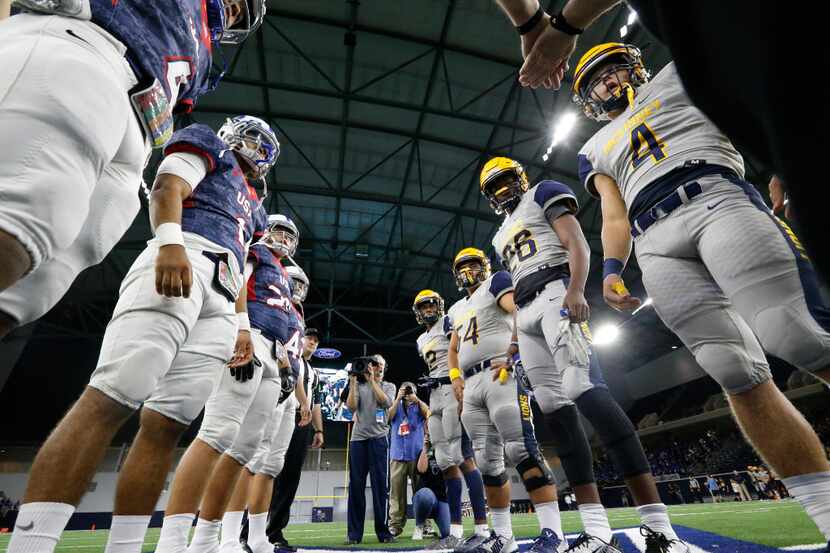 McKinney and Midlothian watch the coin flip before their game at the Ford Center at The Star...