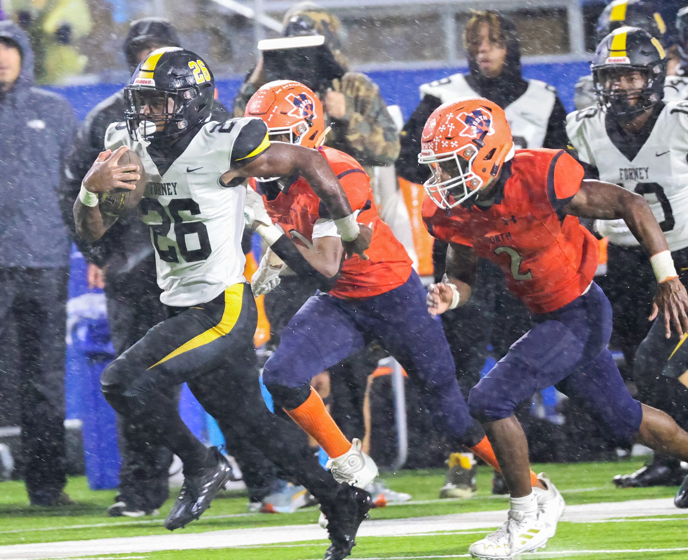 Forney running back Javian Osborne (26) breaks loose from McKinney North defenders as he...