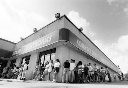 July 11, 1992: A line  snakes around the Sound Warehouse at 5475 Greenville Ave. as fans...