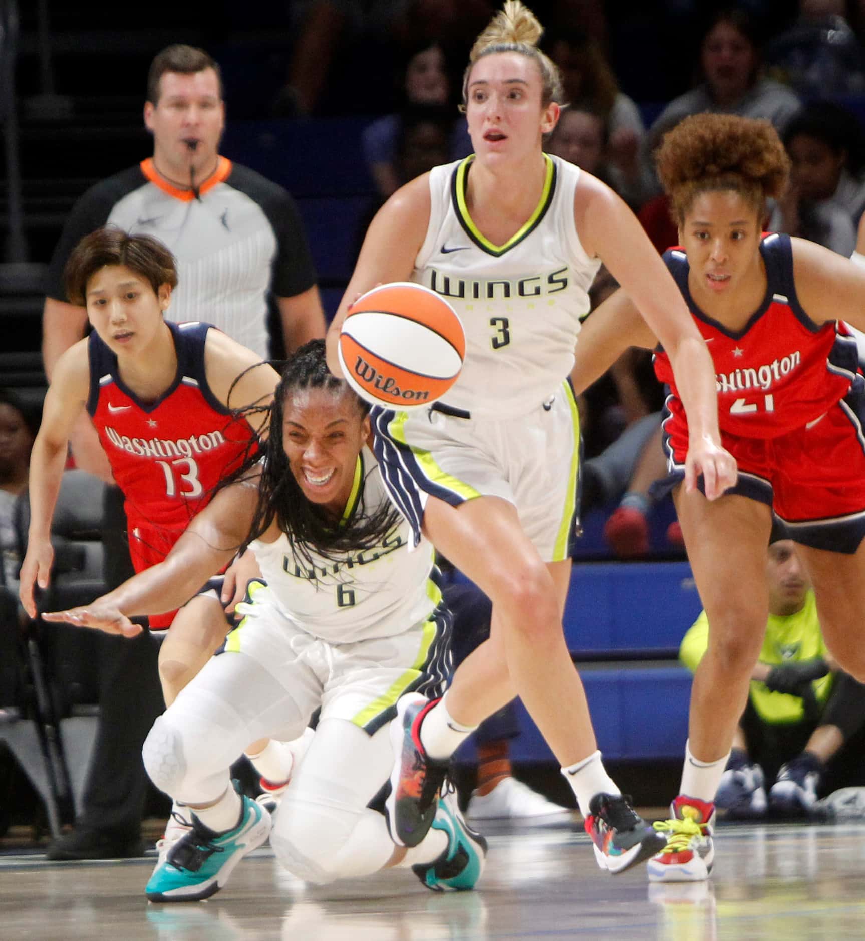 Dallas Wings guard Marina Mabrey (3) wins the battle for a loose ball over teammate forward...