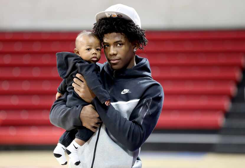 Kendric Davis poses with his 4-month-old son Kendric Jr, at SMU's Moody Coliseum in Dallas,...