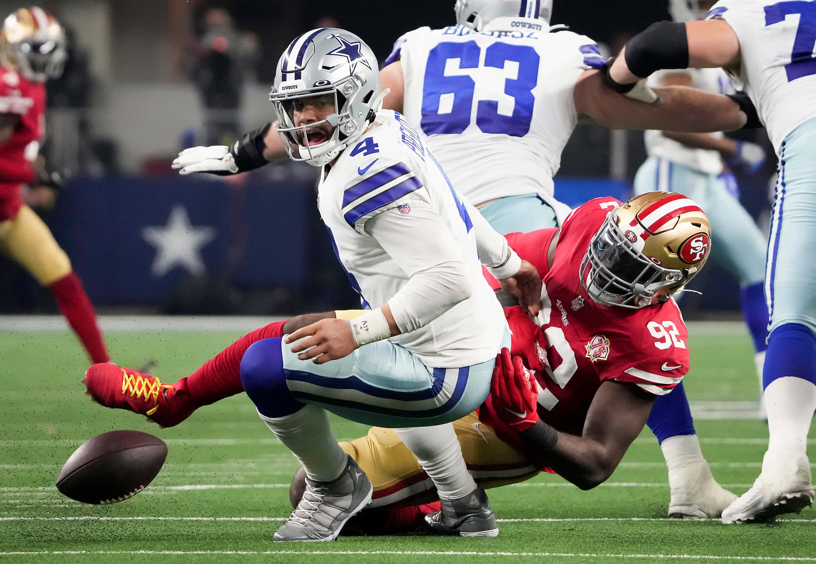 Dallas Cowboys quarterback Dak Prescott (4) fumbles as he is sacked by San Francisco 49ers...