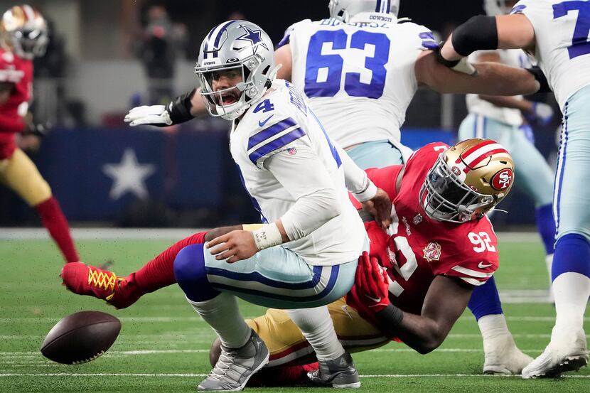 Dallas Cowboys quarterback Dak Prescott (4) fumbles as he is sacked by San Francisco 49ers...