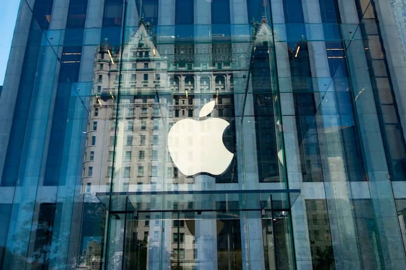 (FILES) This file photo taken on September 14, 2016 shows the Apple logo at the entrance to...