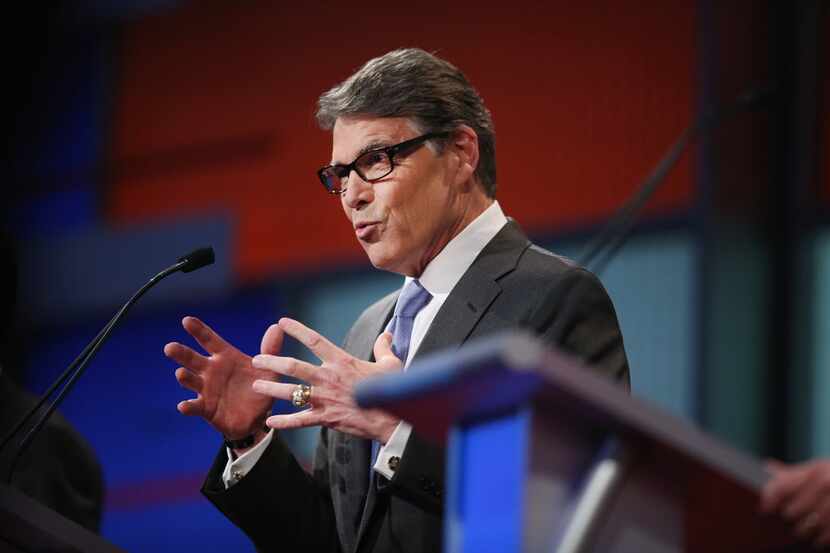  Republican presidential candidate Rick Perry fields a question during a presidential forum...