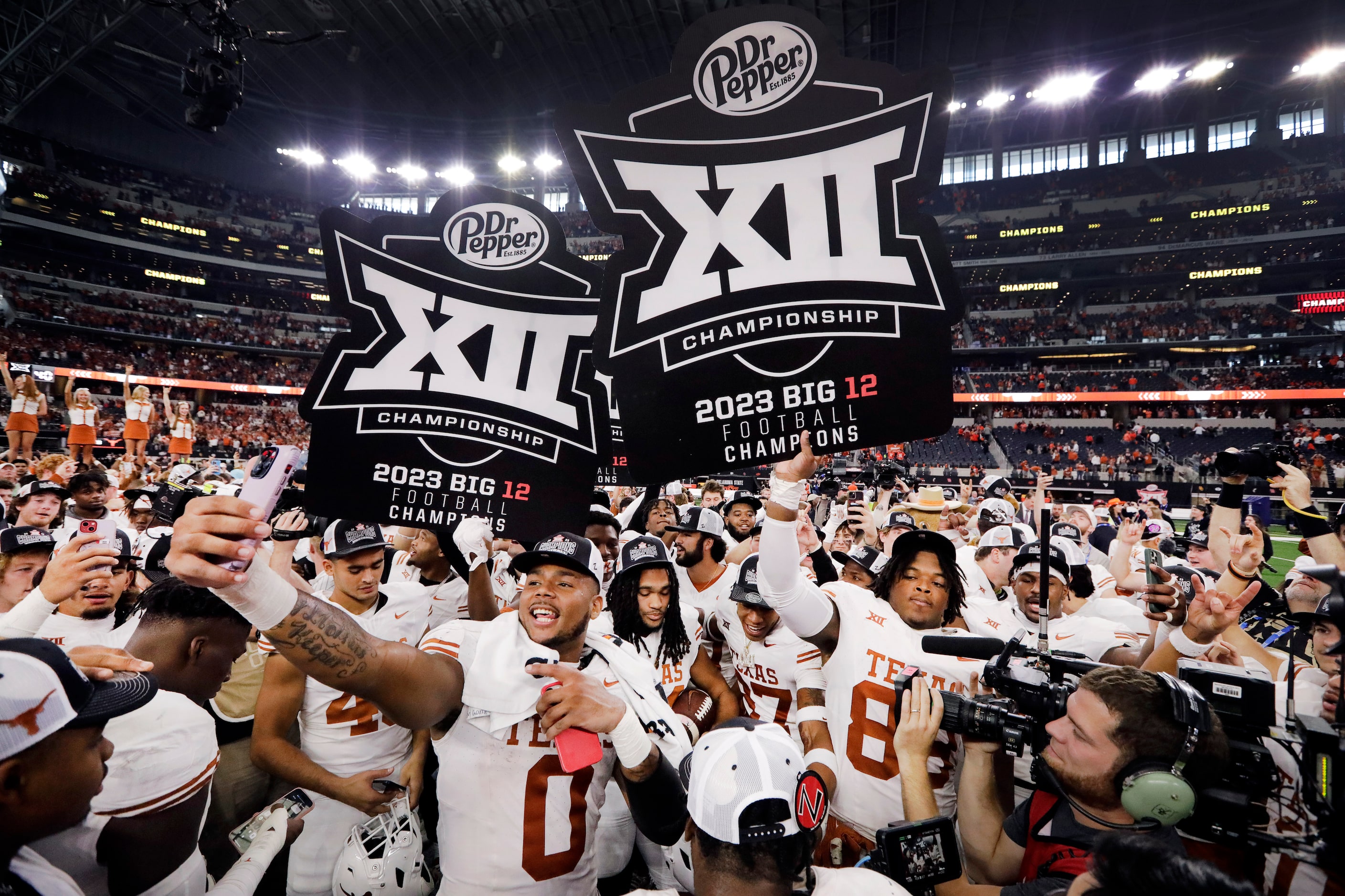 Texas Longhorns celebrate their Big 12 Championship win over the Oklahoma State Cowboys at...