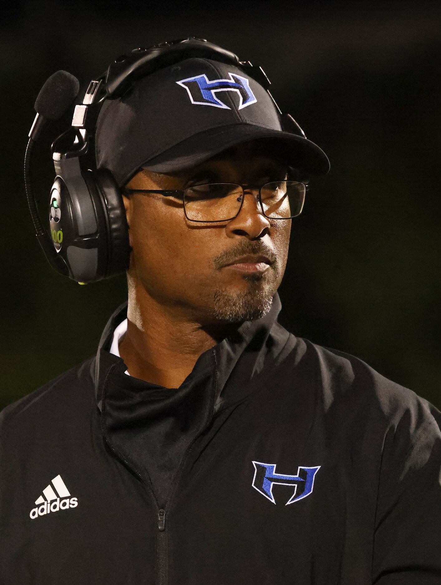 Hebron High School head coach John Towells III looks to the sidelines during the football...