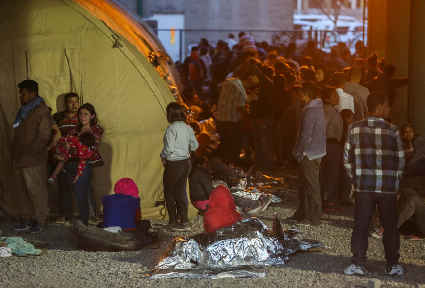 Migrants, including young children and babies, seeking asylum wawit at a U.S. Border Patrol...