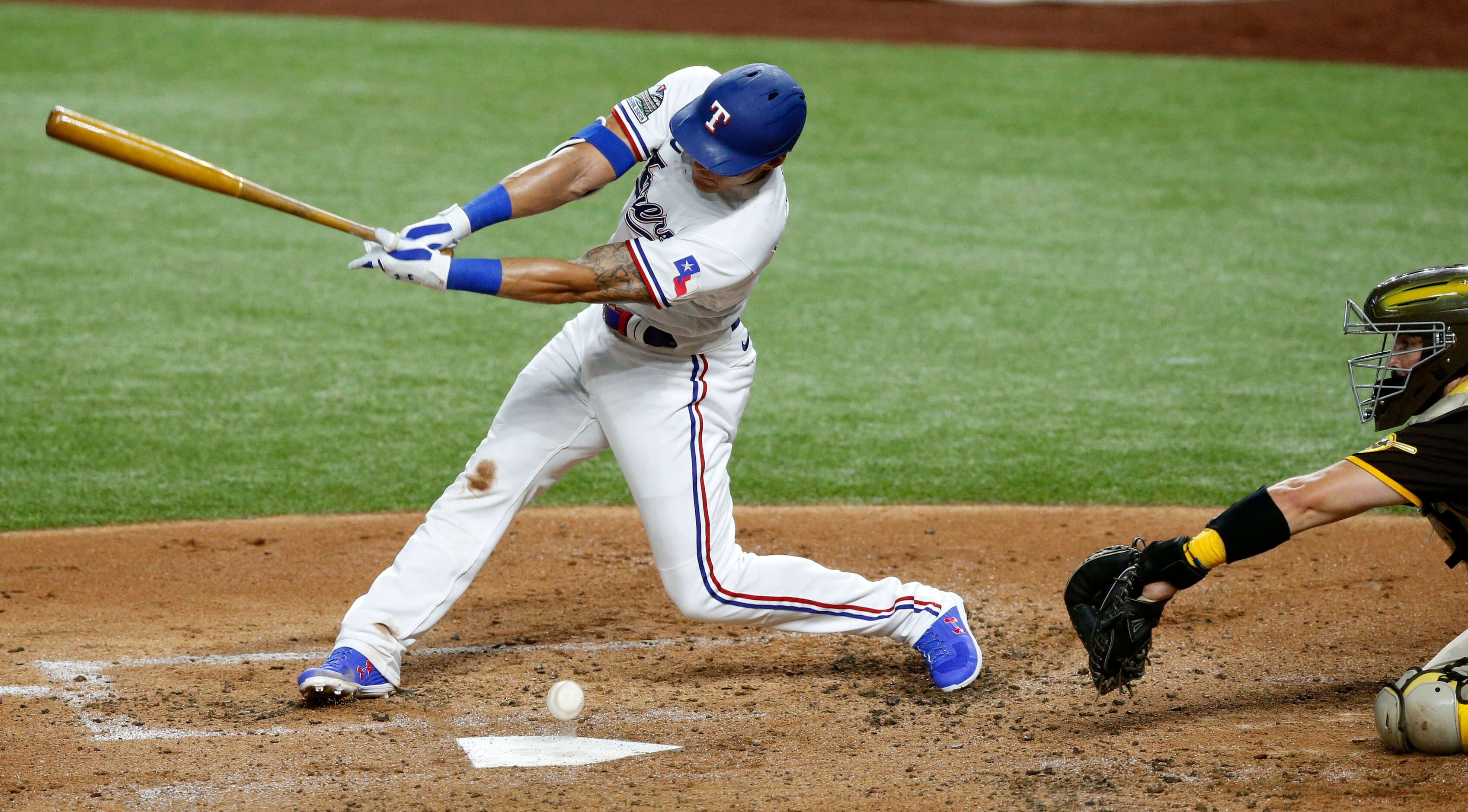 Texas Rangers first baseman Derek Dietrich (32) fouls a ball off of home plate as San Diego...