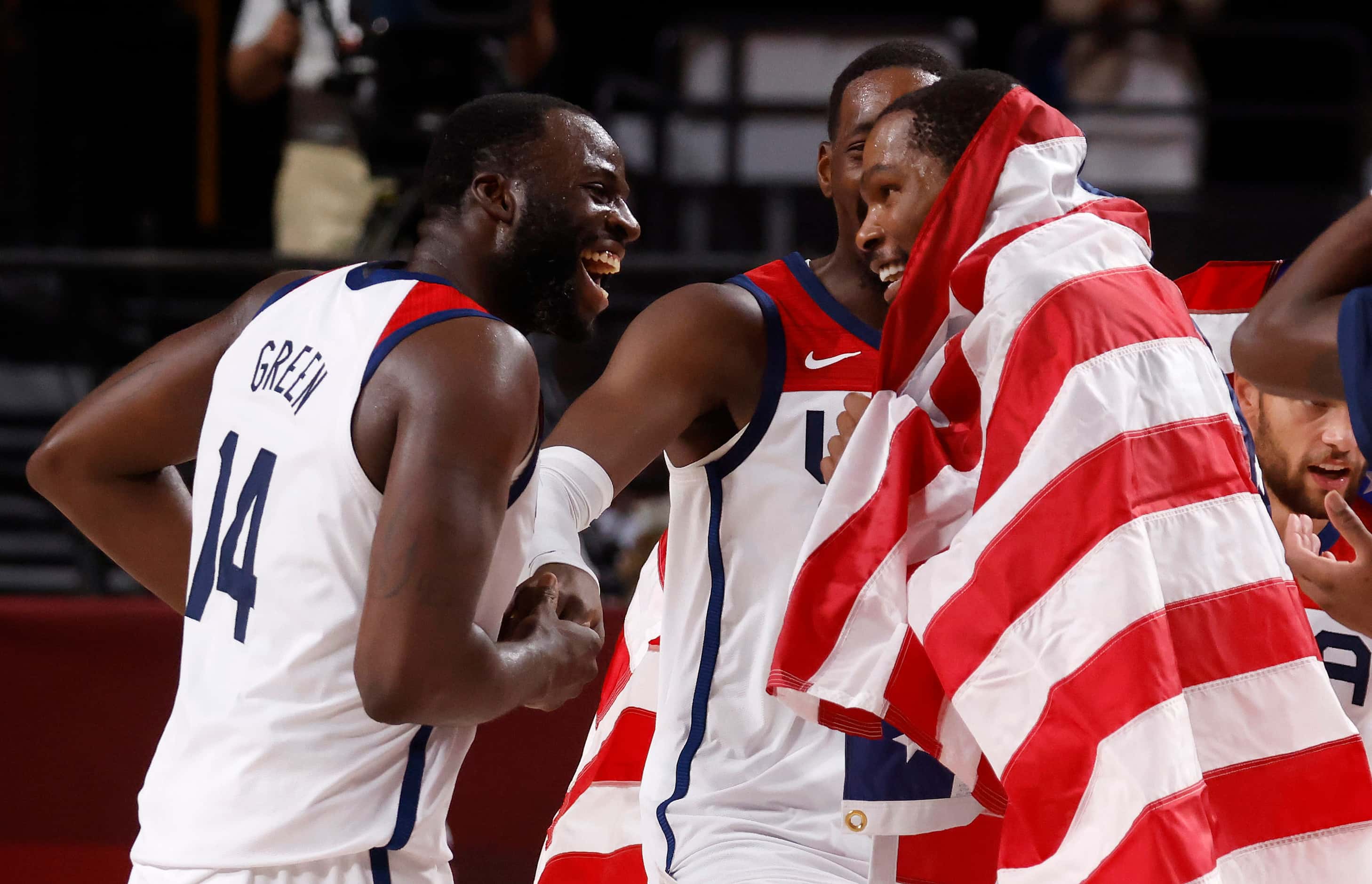 USA’s Draymond Green (14), Bam Adebayo (13) and Kevin Durant (7) celebrate defeating France...
