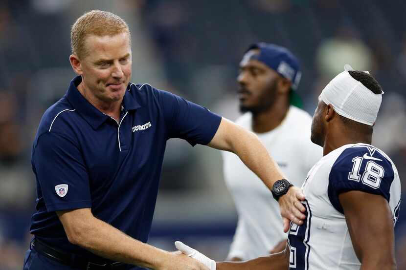 Dallas Cowboys head coach Jason Garrett greets Dallas Cowboys wide receiver Randall Cobb...