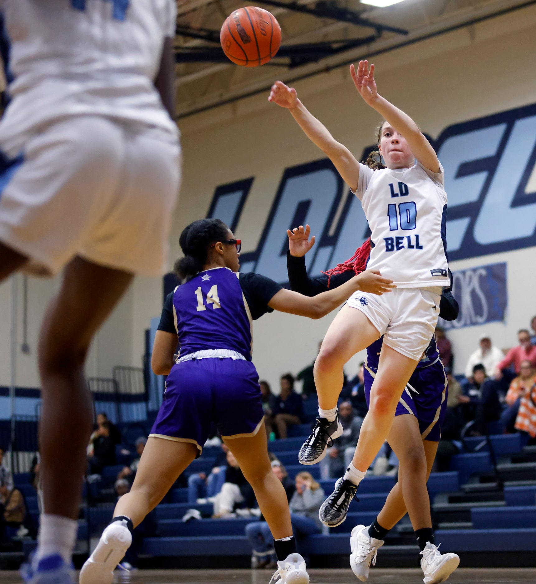 Hurst L.D. Bell’s Katelyn Tietjen (10) passes the ball to the scorner as she was guarded by...