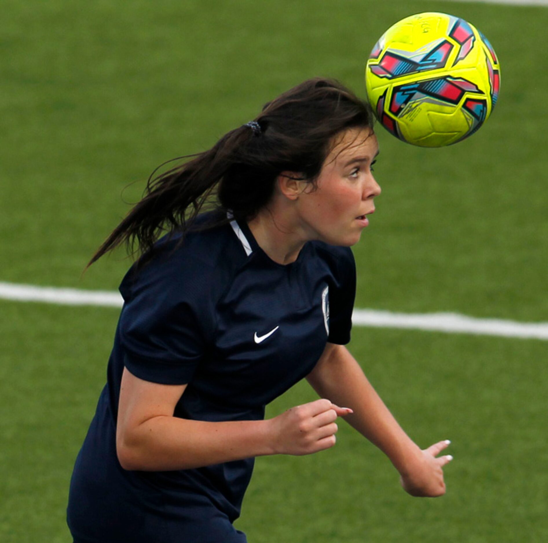 Flower Mound's Riley Baker (19) moves the ball upfield during first half action against...