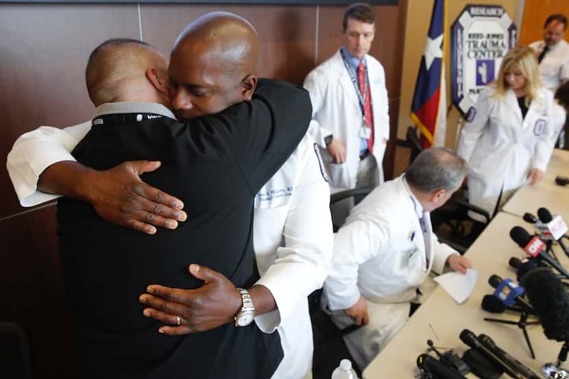 Dr. Alexander Eastman (left), medical director/chief of Rees-Jones Trauma Center, and Dr....