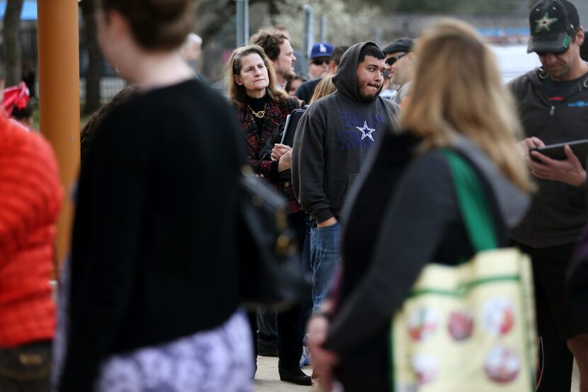 Residents wait outside the Walnut Hill Recreation Center before a meeting for people who are...