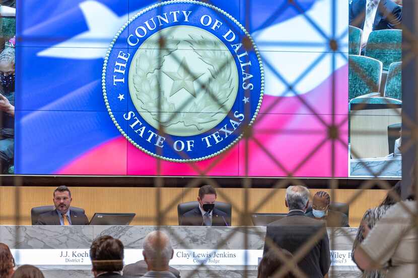Dallas County Commissioners J.J. Koch, Clay Jenkins and John Wiley Price are seen from the...
