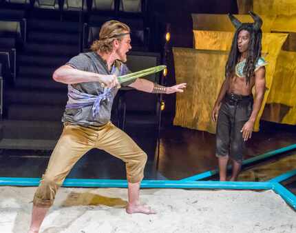 Kyle Igneczi as Theseus, left, and Darren McElroy as The Minotaur in the regional premiere ...